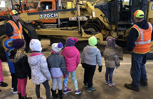 Cindy Nielsen and Mike Slater talk with students at Mankato Truck Station.